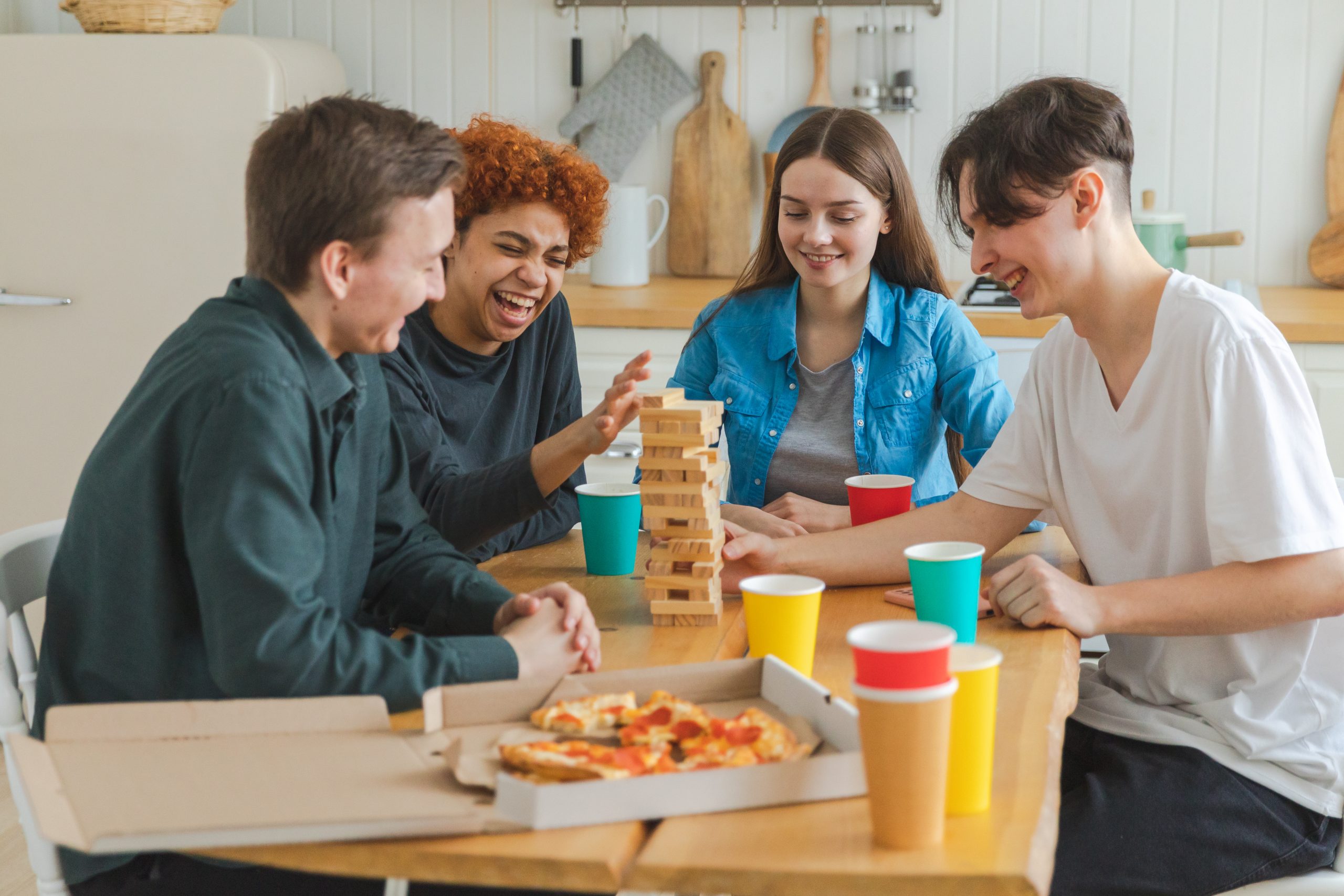 Home party. Friends spending time together playing in board game crash wooden tower at home. Happy diverse group having fun together indoor. Mixed race young buddies best friends enjoying weekend. L'histoire de CogniMinds remonte en 2020, lorsque l'un de nos co-fondateurs découvre l'univers du jeu de société.